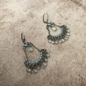 Silver tone baby blue dangle earrings.